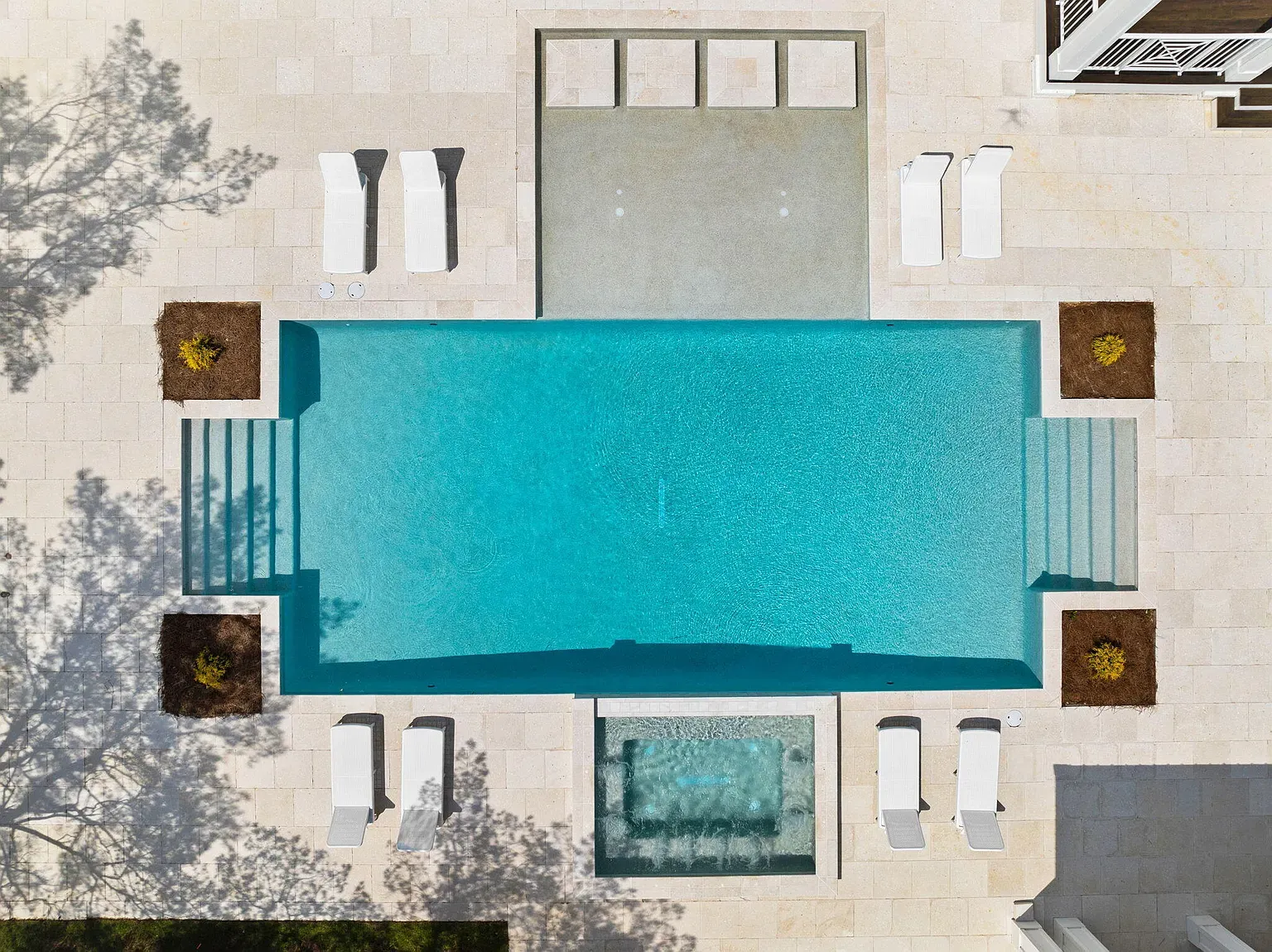 Open-concept luxury living room with coastal-inspired decor and natural light