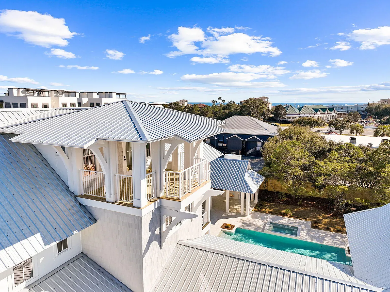Sunset poolside lifestyle scene showcasing the luxury coastal guest experience
